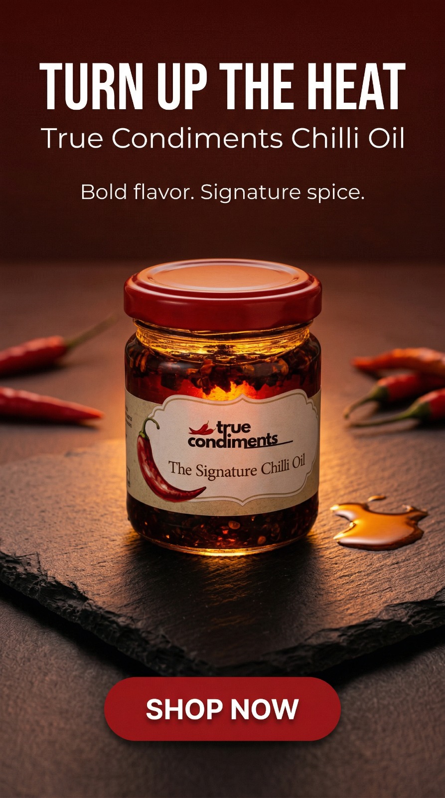 Turn Up The Heat — The Signature Chilli Oil jar on slate with fresh red chillies